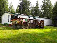 This 10+ acre property has multiple outbuildings to include barn, tack room, loafing barn, hay barn & wood shed in Sagle, Idaho