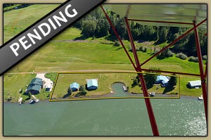 One of a kind large waterfront parcel with nice home, hanger in Clark Fork, Idaho