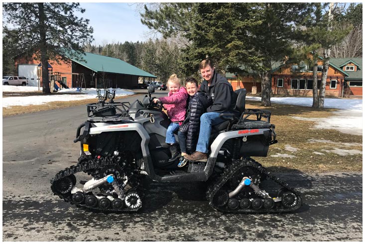 Eric Skinner taking the Grandkids for a wheeler ride